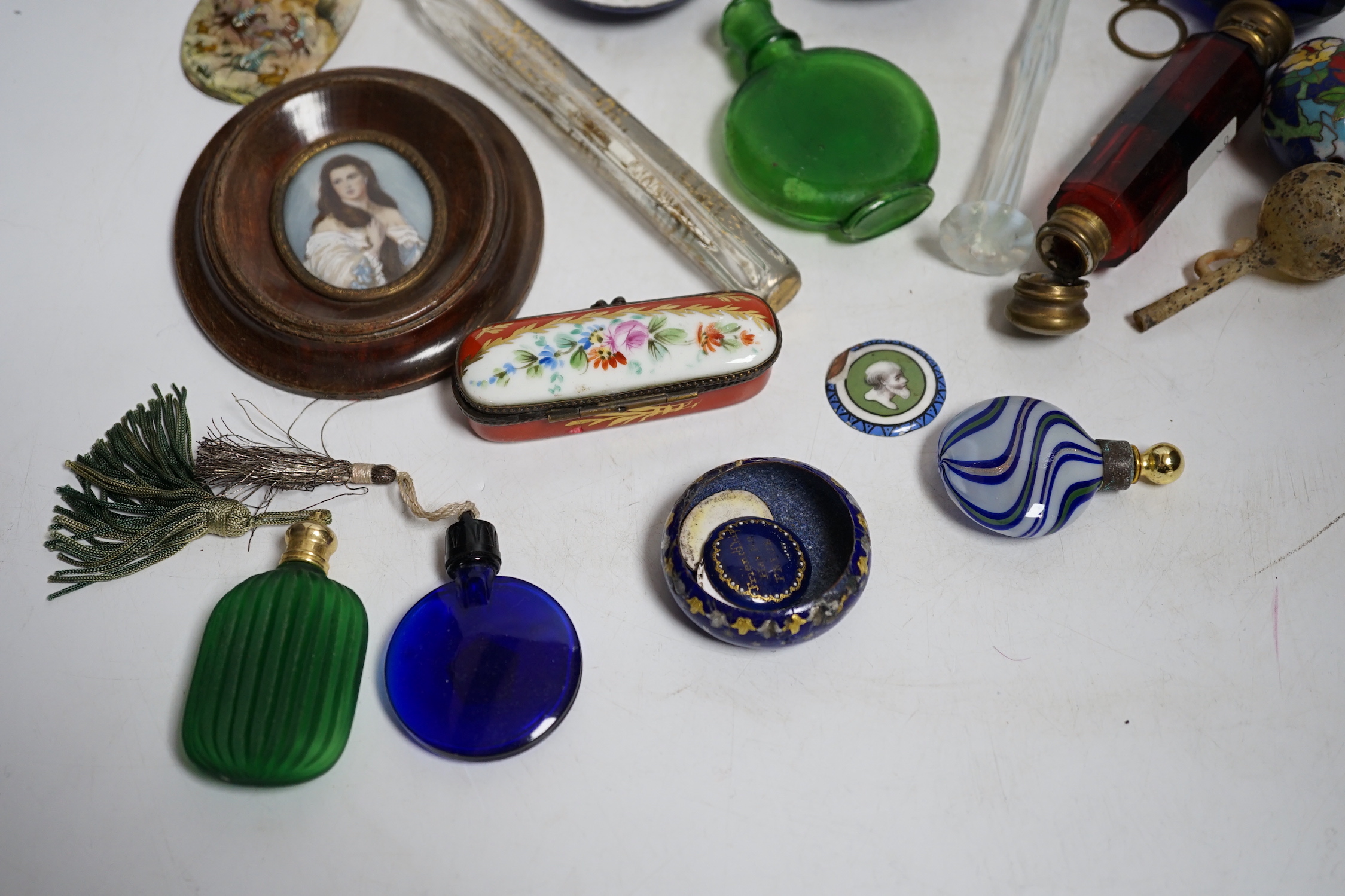 A collection of scent bottles, a miniature antiquity vessel and a miniature of a lady
